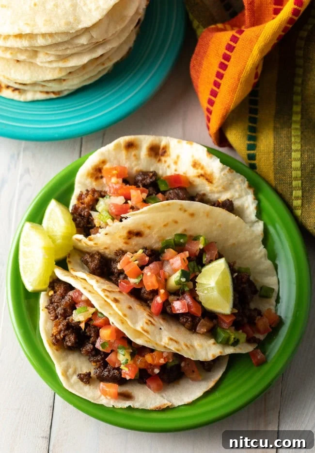 Best Homemade Flour Tortilla Recipe for tacos - filled tacos on plate 
