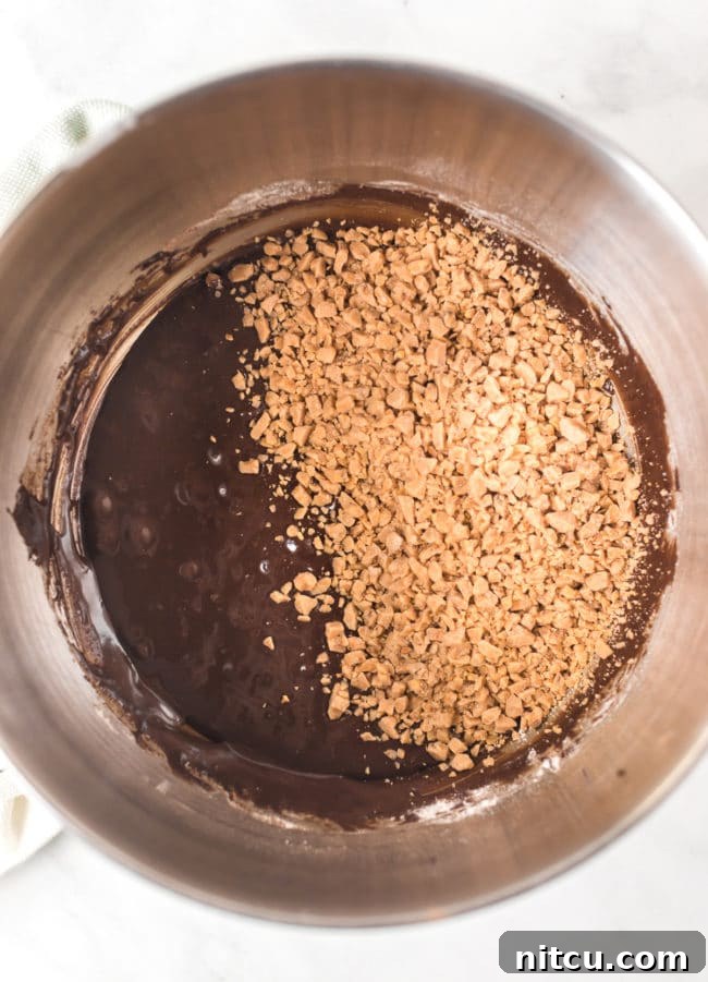 adding toffee bits to cookie dough