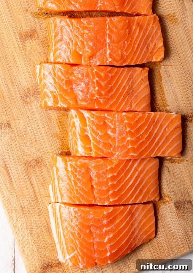 Salmon fillets on a cutting board. 
