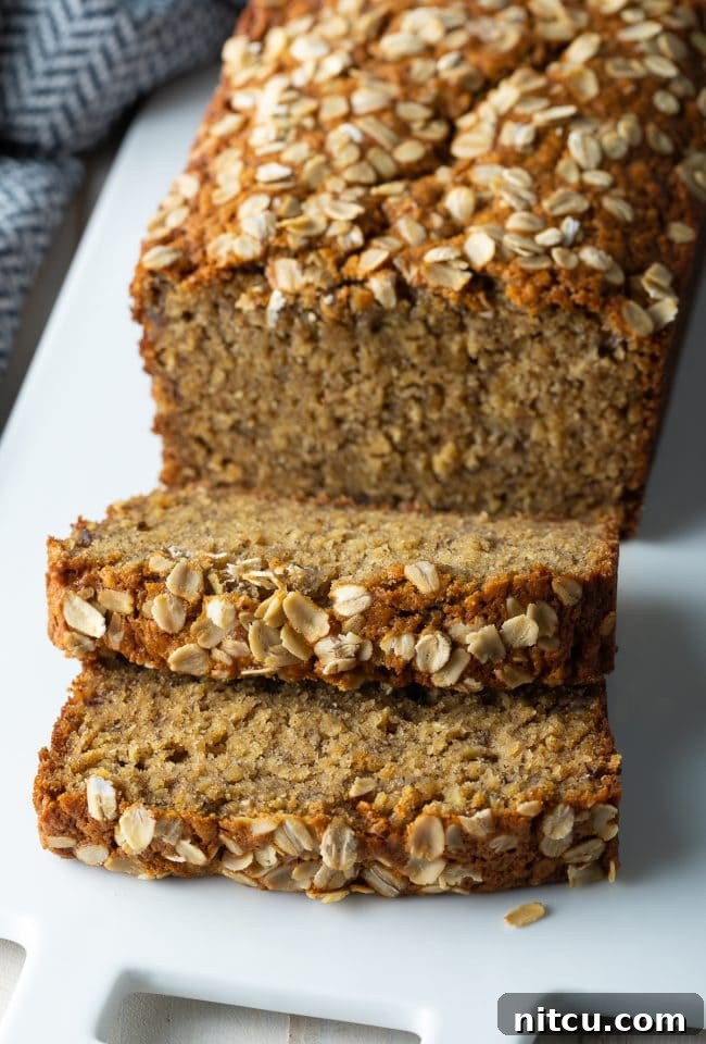 Delicious banana oat bread slices on a rustic plate, ready to be enjoyed.