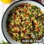 A vibrant and refreshing Greek Orzo Pasta Salad with Lemon Vinaigrette.