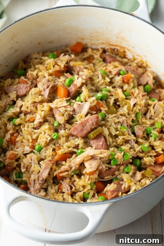 Chicken Bog Recipe with sausage and peas in large white pot