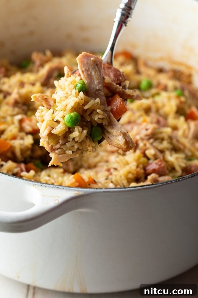 Big bite of chicken rice pilaf