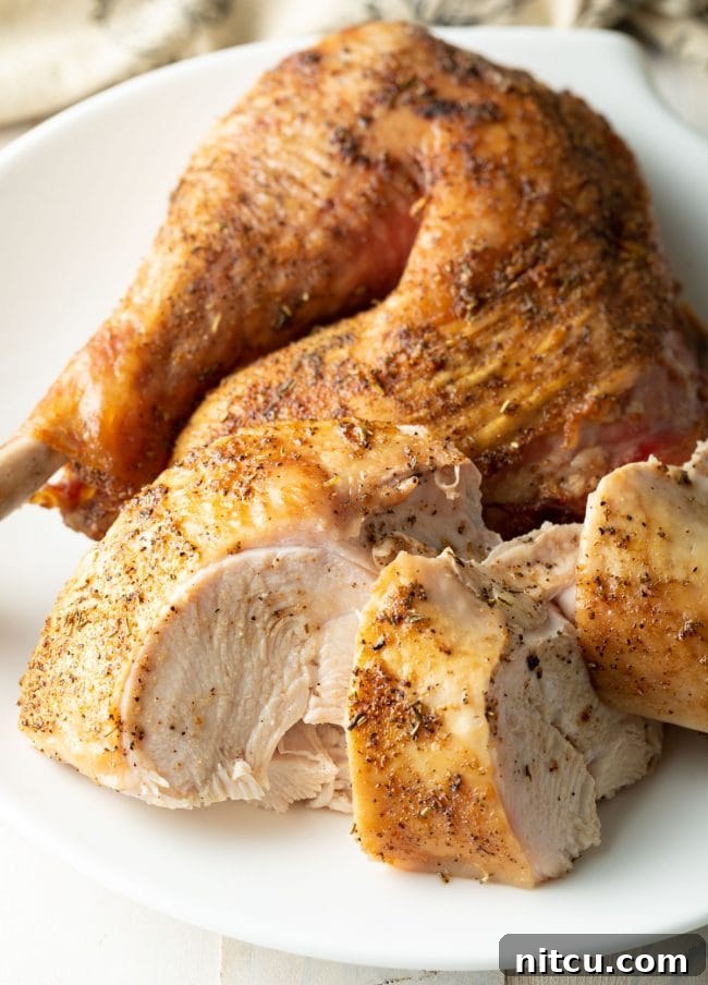 A spatchcocked turkey sliced open to reveal the juicy inside.
