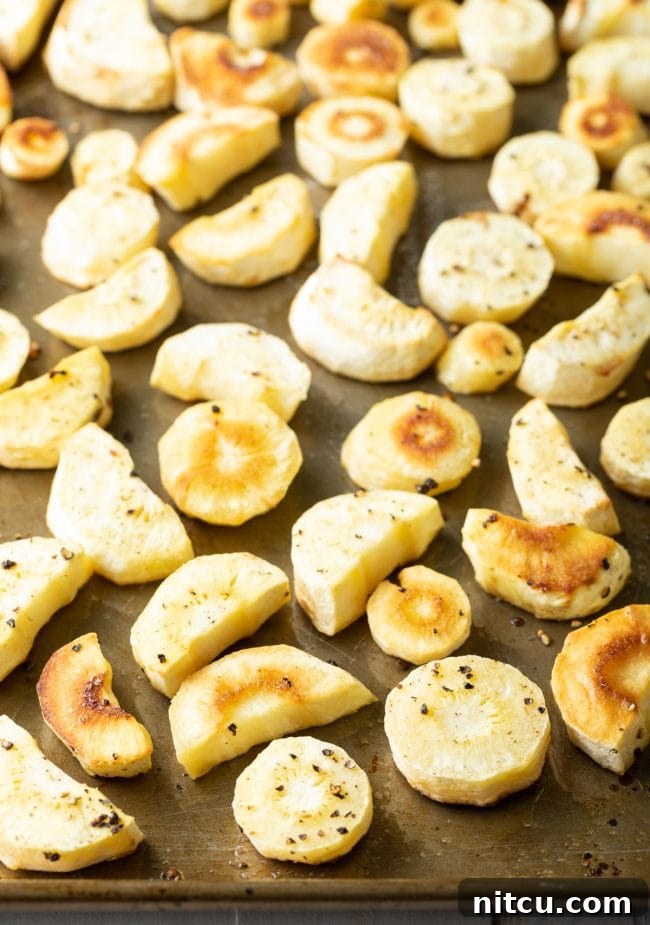 baked parsnips on baking sheet