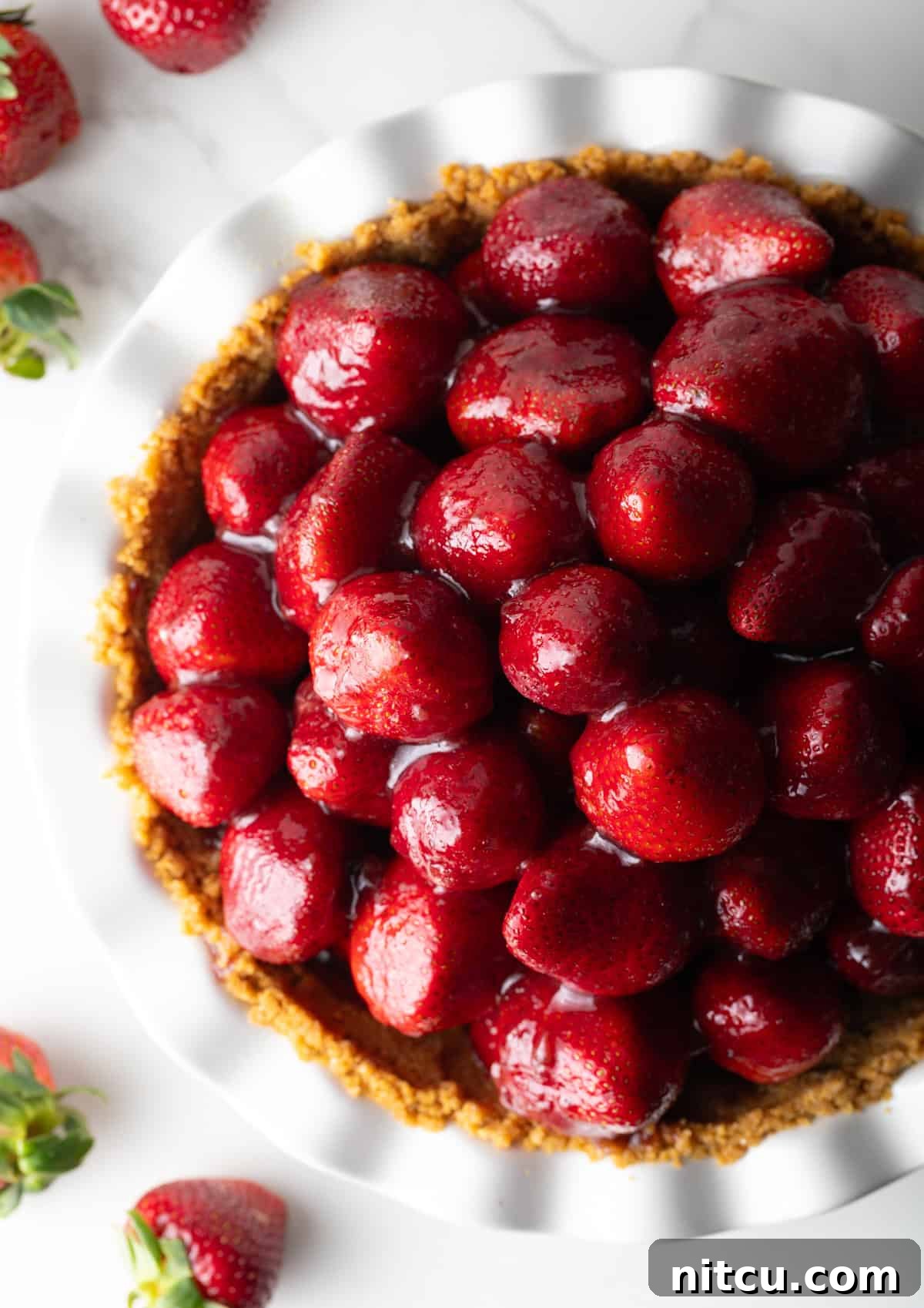 A fresh strawberry pie loaded with glazed strawberries.
